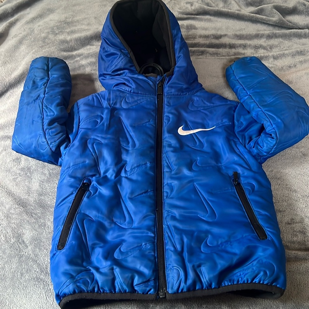 Size 4/5 runs little big nike coat